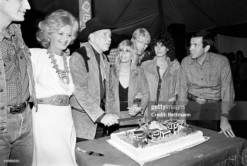 Frank Sinatra Cutting Birthday Cake at Party