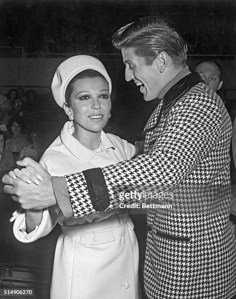 Nancy Sinatra dancing with Richard Dwyer, world champion ice skater. It's Nancy Sinatra, who has a song written about her when she was two and it was...
