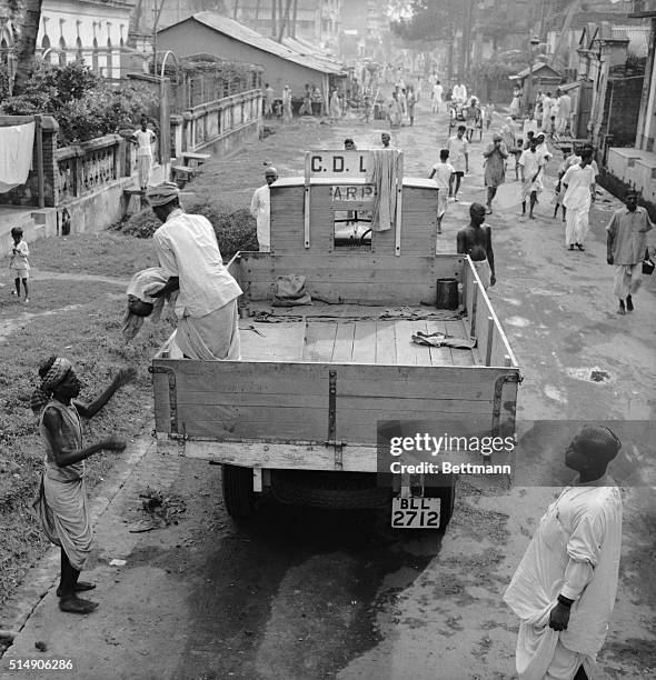 Calcutta, India: Regular Corpse Removal squads were on call in the streets of Calcutta. Famine conditions created by British occupation increased the...