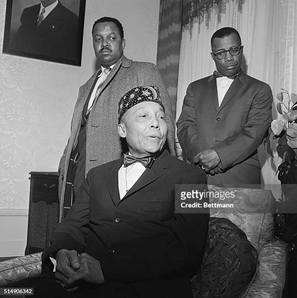 Nation of Islam leader Elijah Muhammad gives a press conference with his son Herbert and Minister James Shabazz . Muhammad denied any involvement in...