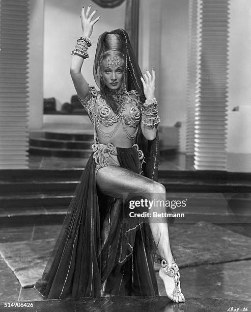 And here is the finished Lady Jamilla , a dancer very much in the groove in old Baghdad in MGM's Technicolor picture "Kismet." Now she's all set to...