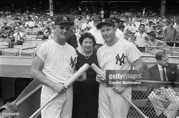 New York, NY- Mrs. Babe Ruth, widow of the great hitter, is flanked by New York Yankees' Roger Maris and Mickey Mantle , both of whom may beat the...