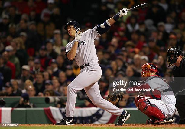 Alex Rodriguez of the New York Yankees hits a two-run home run in the third inning against the Boston Red Sox during game four of the American League...