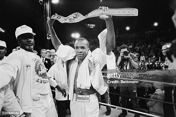 Las Vegas, NV: The winner and new middleweight champion of the world Sugar Ray Leonard, shows off his championship belt after defeating Marvin Hagler.