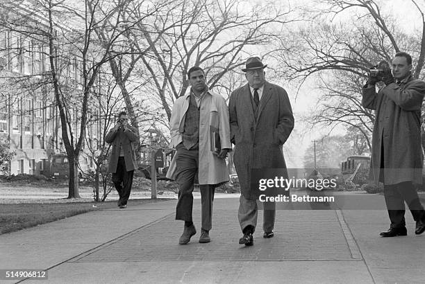 Athens, GA- Negro student Hamilton Holmes walks with Dean William Tate on the University of Georgia campus, following the first integrated classes in...
