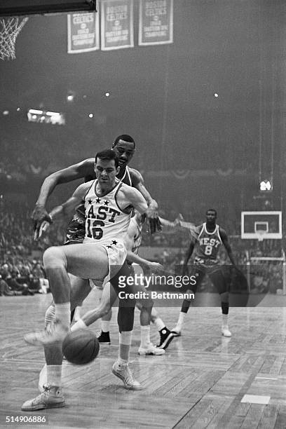 Boston,MA- 14th Annual NBA All-Star game... Jerry Lucas of East team doesn't look very happy after big Wilt Chamberlain of West used his long arms to...