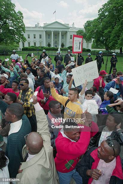 Elevated view of demonstrators, among them Howard University students, as they protest against the Rodney King verdict, outside the White House,...