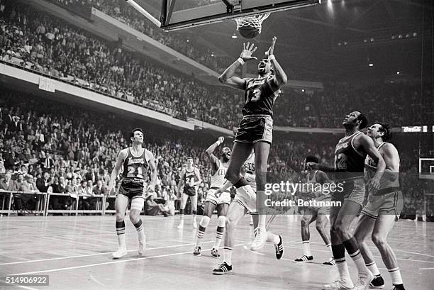 Boston,MA- LA Lakers' Wilt Chamberlain grimaces as Celtics' Sam Jones winning basket, with one second left in game, parts the twine, 4th quarter, 4th...