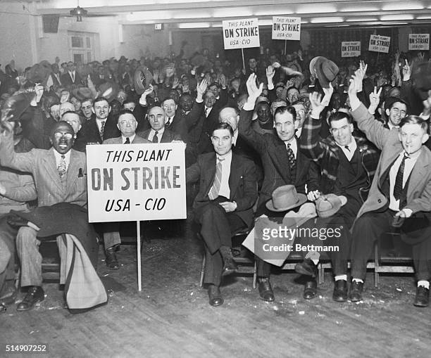 Gary, IN- Workers of the Carnegie Illinois Steel Corporation are shown at a mass meeting in Gary, where it was charged that the company violated the...