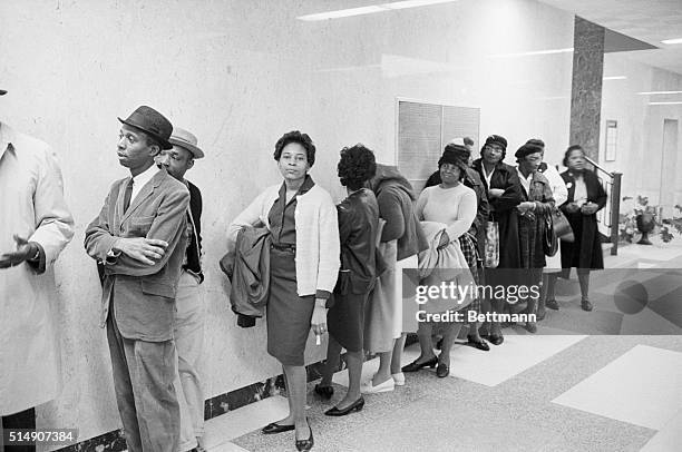 Selma, AL- Negro voter applicants wait in line in a corridor of the Alabama Dallas County Courthouse after having been admitted by an assigned number...