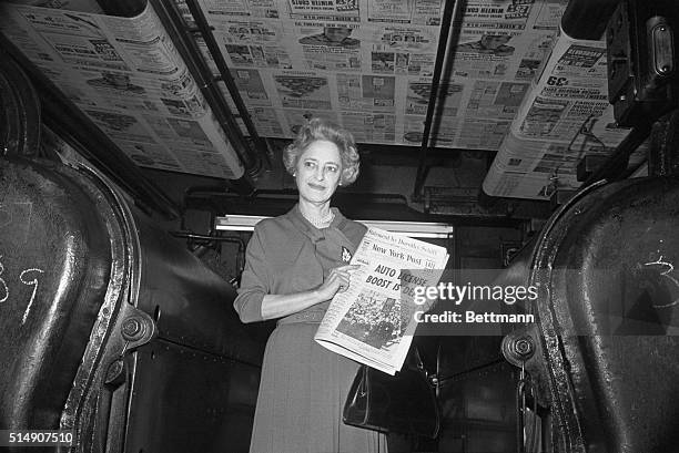 With copies of the paper being run off the press overhead, "New York Post" publisher, Mrs. Dorothy Schiff, points proudly to the first Post edition...