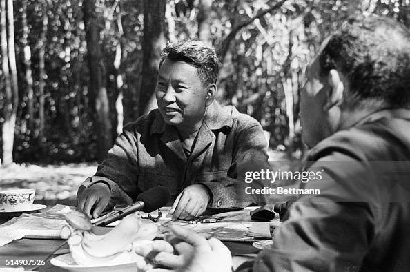 Pol Pot, leader of the Khmer Rouge, in the Cambodian jungle with an