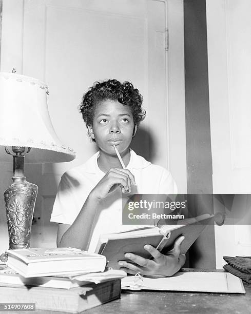 Little Rock, AR- Elizabeth Eckford spends an evening at home studying her scholl books after she had been turned away from Little Rock's all White...