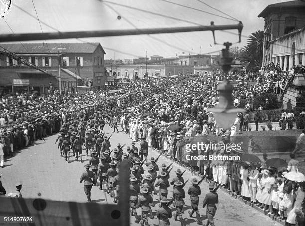 San Juan, Puerto Rico- Troops parading through the streets of San Juan during the inaugural celebration marking the advent of the new Governor...