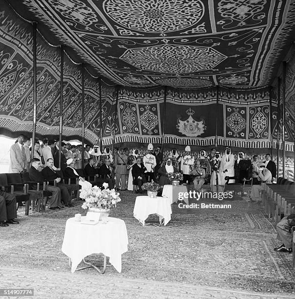 Baghdad, Iraq- In Middle Eastern splendor, visiting King Saud of Saudi Arabia is welcomed to Baghdad, Iraq by King Faisal and Iraqui Premier Nuri...