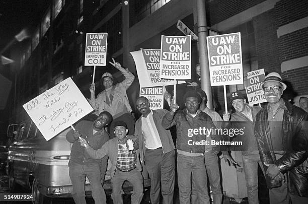 Detroit, MI-General Motors workers wave picket signs outside a Detroit GM plant after the United Auto Workers struck giant General Motors at midnight...