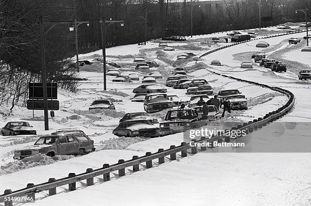 New York, NY: - PRIZE-WINNING PHOTO taken by Jack Baletti of UPI-New York shows stranded motorists trying to dig out their snowed-in cars that were...