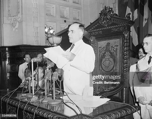 Rio de Janeiro, Brazil-Standing before the assembled delegates and the microphones massed on his desk, President Getulio Vargas of Brazil, his summer...