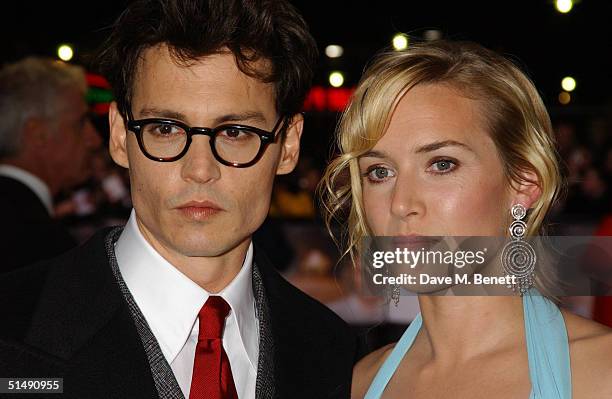 Actors Johnny Depp and Kate Winslet arrive at the UK Charity Premiere of "Finding Neverland" at the Odeon Leicester Square on October 17, 2004 in...