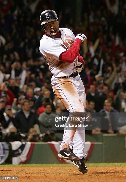Dave Roberts of the Boston Red Sox celebrates after scoring the game-tying run on a single by Bill Mueller in the ninth inning against the New York...
