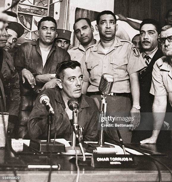 Panama City, Panama-Panamanian strongman Brigadier General Omar Torrijos, surrounded by supporters, addresses the nation on television following his...