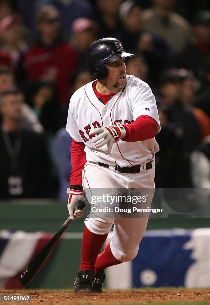 Bill Mueller of the Boston Red Sox hits the game-tying RBI single in the ninth inning against the New York Yankees during game four of the American...