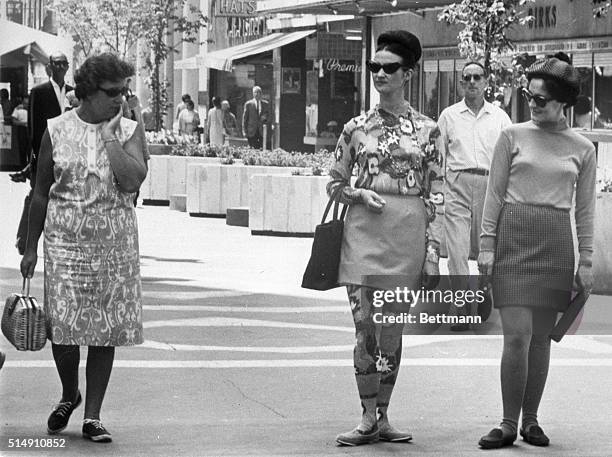 Ottawa, Canada-Oh my, those fashions! This seems to be the expression the woman on the left is thinking, as she views two girls wearing the latest on...