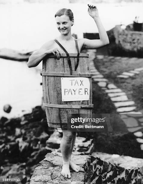 Mary Parrish of Marblehead, Massachusetts, stole the show at the annual Artists Ball, appearing in a barrel to represent the present-day tax payer.