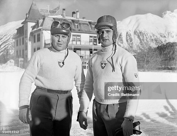 St.Moritz, Switzerland- These two dare-devils, members of the Swiss Olympic bobsled squad, congratulate each other after winning the two-man bobsled...