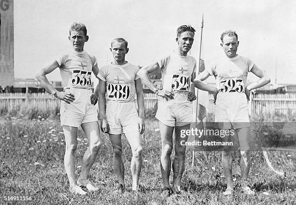 Paris, France- The victorious Finnish team poses before the start of the Olympic cross-country race. Pictured are: V.J. Sipila; E.E. Berg; V. Ritola,...