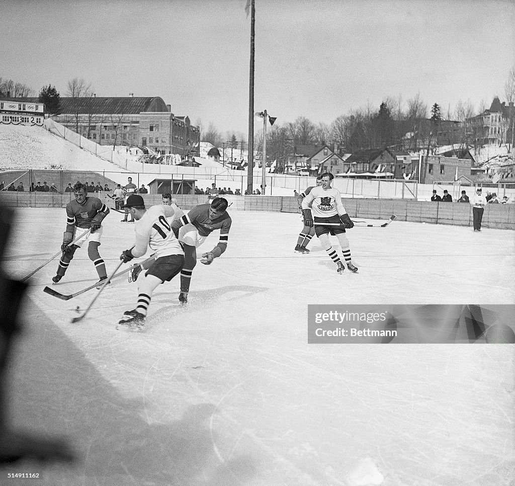 Hockey Players Battle for Puck