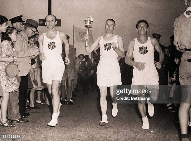 Dover, England- OLYMPIC TORCH THROUGH THE NIGHT. Hand-picked runners in relays carried the Olympic torch from Dover, where it was landed from a...