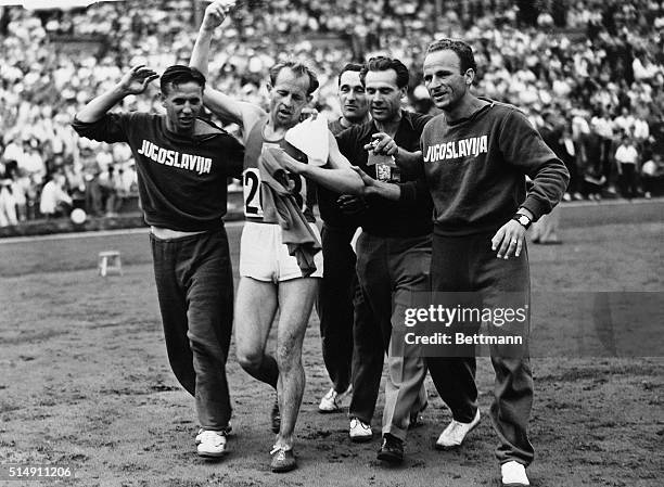 Wembley, England- E. Zatopek of Czechoslovakia wins the 10,000-meter race to capture the first Gold Medal in 1948 Olympic Play at Wembley Stadium on...