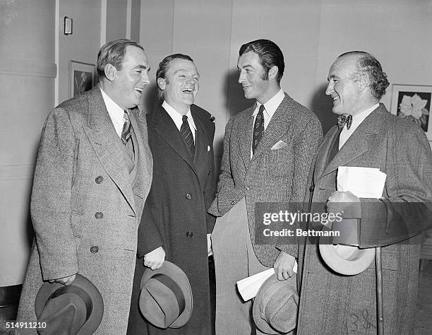 Hollywood, CA- Pat O'Brien, James Cagney, Robert Taylor, and Donald Crisp share a laugh together while attending the broadcast rehearsal for the...