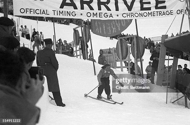 St. Moritz, Switzerland- Pretty 28-year-old Vancouver, Washington housewife, skier Gretchen Frasier, pictured flashing across the finish line to win...