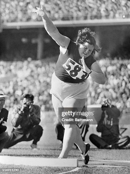 Melbourne, Australia- Russia's Tamara Tychkevitch, gets off a toss of 54 feet, 5 inches, to win the Woman's Olympic shotput here, Nov. 30, with a new...