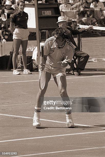 Forest Hills, NY- A frenzied Ilie Nastase vents his temper on the court during his match against West Germany's Hans-Jurgen Pohmann in the U.S. Open...