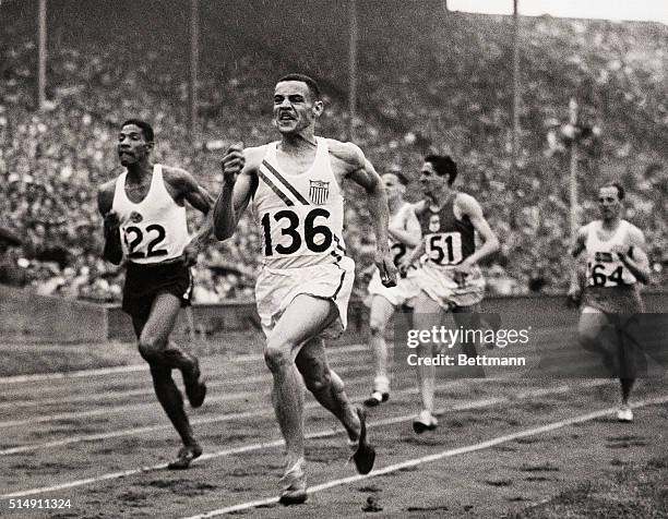 London England- Mal Whitfield of Ohio State forges to the front at the half-way mark never to relinquish the spot as he sets a new Olympic record of...