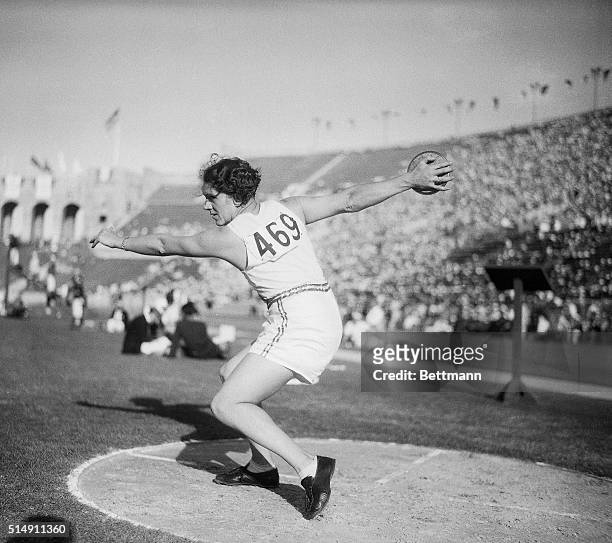 Los Angeles, CA- Lilliam Copeland of the United States summons up power enough to throw the discus a distance of 133 feet, 2 inches to smash the...
