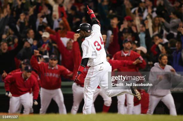 David Ortiz celebrates after hitting the game winning two-run home run against the New York Yankees in the twelfth inning during game four of the...
