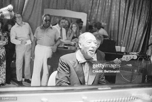 New York, NY- Duke Ellington performs at Roseland, during the New York City Newport Jazz Festival. He is shown in a head-and-shoulders view, seated...
