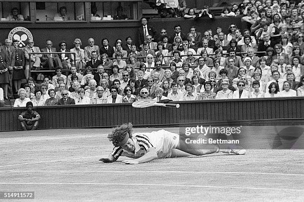 Wimbeldon: The Men's Singles final. John McEnroe falls to the ground in a heavy fall and his racket goes flying, during his battle with Bjorn Borg of...