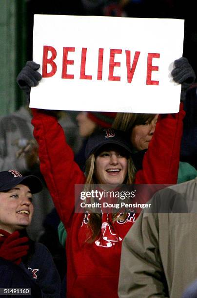 Boston Red Sox fan holds up a sign that reads "Believe" after David Ortiz hit the game winning two-run home run against the New York Yankees in the...