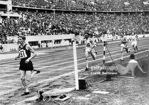 Berlin, Germany- Jack Lovelock of New Zealand is shown winning the Olympic 1500-meter event from Glen Cunningham of Kansas. Both men broke the...