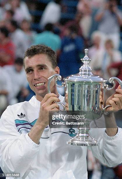 Flushing Meadows, NY- Ivan Lendl with trophy after defeating Mats Wilander to win the US Open Championship for the third consecutive year.