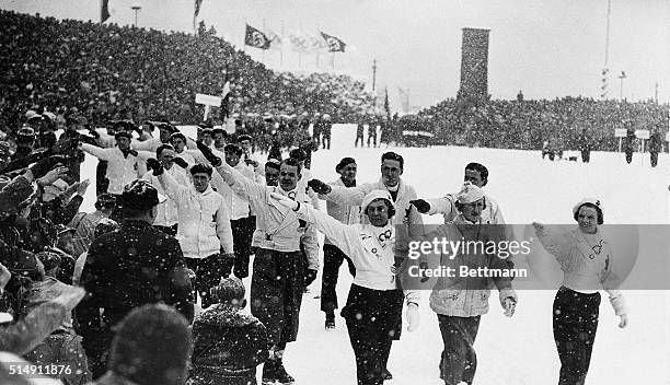 Garmisch Partenkirschen, Germany- Members of the Canadian Winter Olympics team return a Nazi salute, as they pass the reviewing stand in the parade...