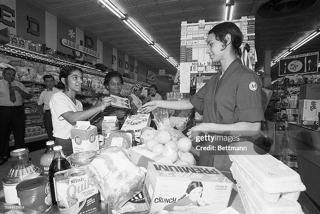 Woman Buying Groceries with Food Stamps