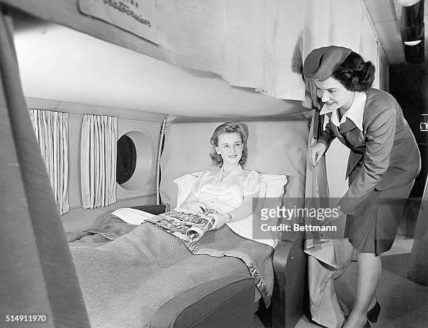 Overnight intercontinental service will be a routine accomplishment of the Boeing Stratocruiser. A total of 28 berths, upper and lower, line the main...