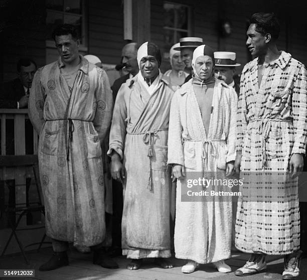 Antwerp, Belgium: Norman Ross, Keahola, McGill and Duke Kahanamoku, the U.S. Olympic Relay Team winners, are shown in robes and swimming caps.