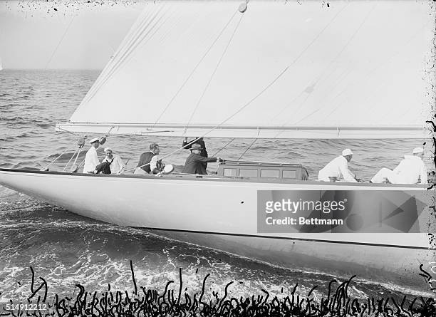 Glen Cove, NY- Photo of Junius S. Morgan, Jr., the son of J.P. Morgan, at the helm of his yacht, "Windward," during the New York Yacht Club Spring...